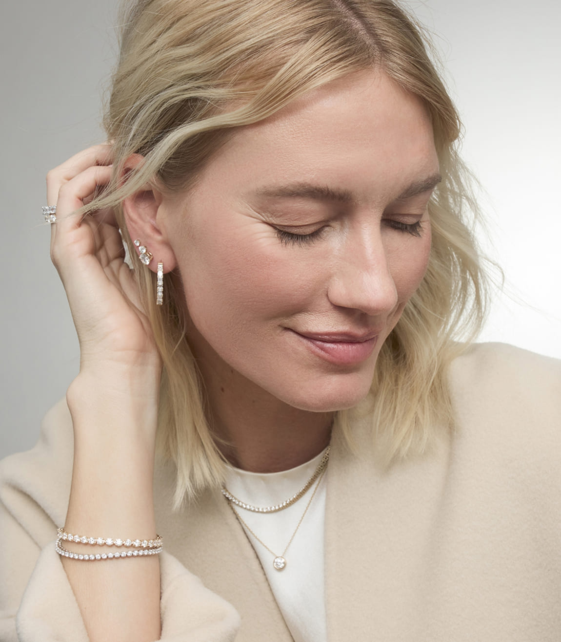 Blue Nile diamond jewelry essentials worn by model